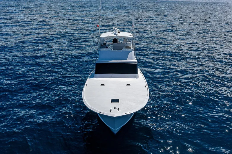 Will Rise Yacht Photos Pics Custom Carolina 58 yacht, 2005 model, cruising on open water.