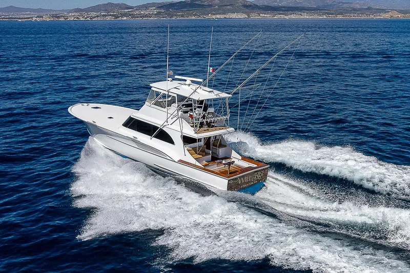 Will Rise Yacht Photos Pics Custom Carolina 58 yacht cruising on open water, 2005 model.