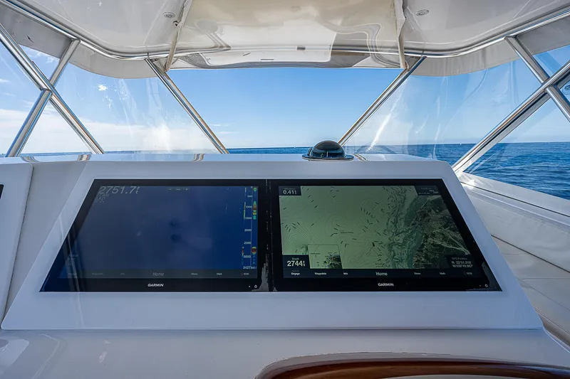 Will Rise Yacht Photos Pics Helm of 2005 Custom Carolina 58 yacht with dual navigation screens.