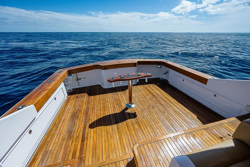 Will Rise Yacht Photos Pics Custom Carolina 58 (2005) boat deck with ocean view and wooden flooring.