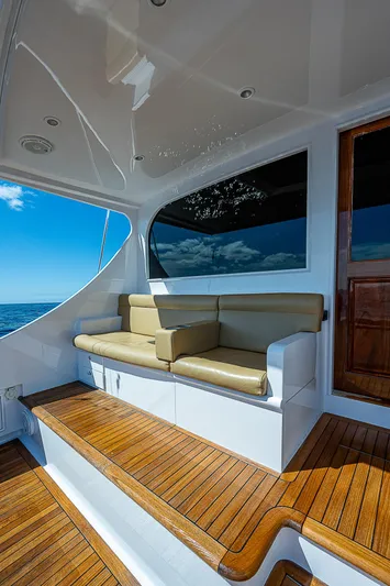 Will Rise Yacht Photos Pics 2005 Custom Carolina 58 yacht with teak deck and cushioned seating area.