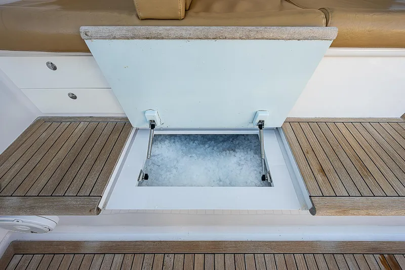 Will Rise Yacht Photos Pics Open storage compartment with ice on a 2005 Custom Carolina 58 boat.