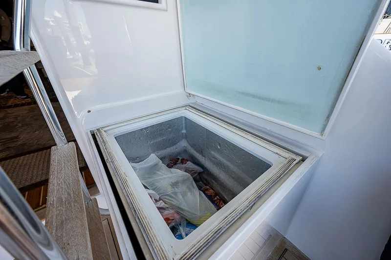 Will Rise Yacht Photos Pics Open storage compartment on 2005 Custom Carolina 58 boat.