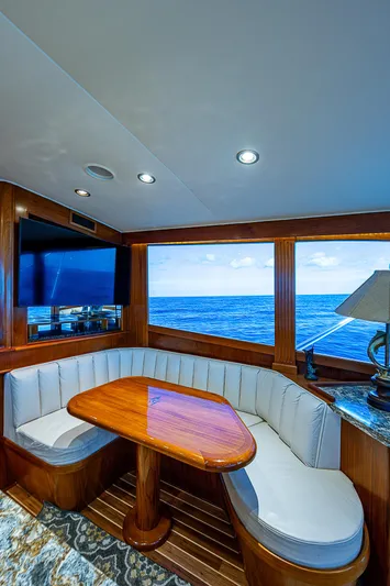 Will Rise Yacht Photos Pics Luxurious dining area on a 2005 Custom Carolina 58 yacht with ocean view.