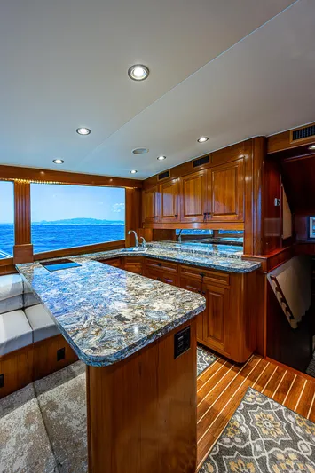 Will Rise Yacht Photos Pics Luxurious interior of 2005 Custom Carolina 58 yacht with granite countertops and ocean view.
