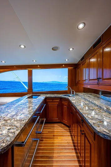 Will Rise Yacht Photos Pics Luxurious kitchen interior of 2005 Custom Carolina 58 yacht with ocean view.