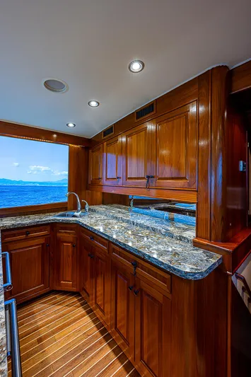 Will Rise Yacht Photos Pics Luxurious kitchen interior of 2005 Custom Carolina 58 yacht with ocean view.