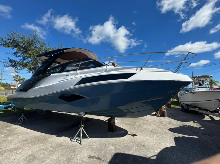  Yacht Photos Pics 2025 NX Boats NX340 on display under a clear blue sky.