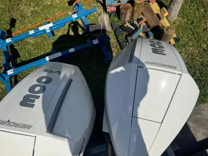  Yacht Photos Pics Twin Mercury 300 outboard engines on NX Boats NX340, 2025 model, with wood and equipment nearby.