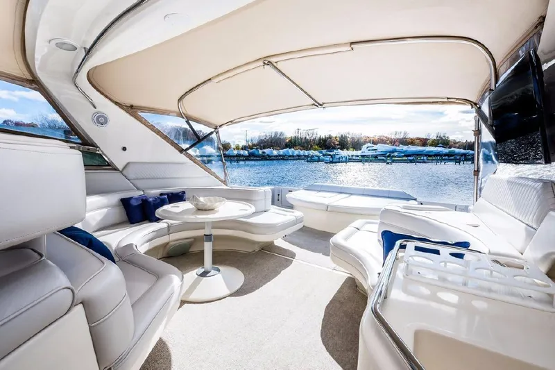  Yacht Photos Pics Luxurious 1996 Sea Ray 630 Super Sun Sport yacht interior with elegant seating and waterfront view.