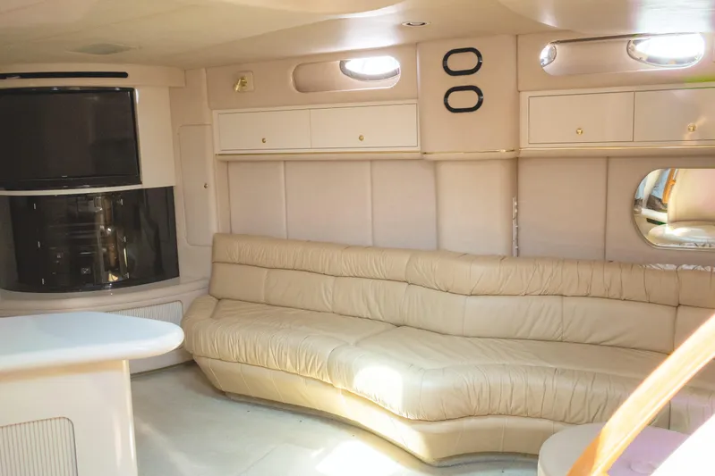  Yacht Photos Pics Luxurious interior of 1996 Sea Ray 630 Super Sun Sport yacht with beige leather seating.