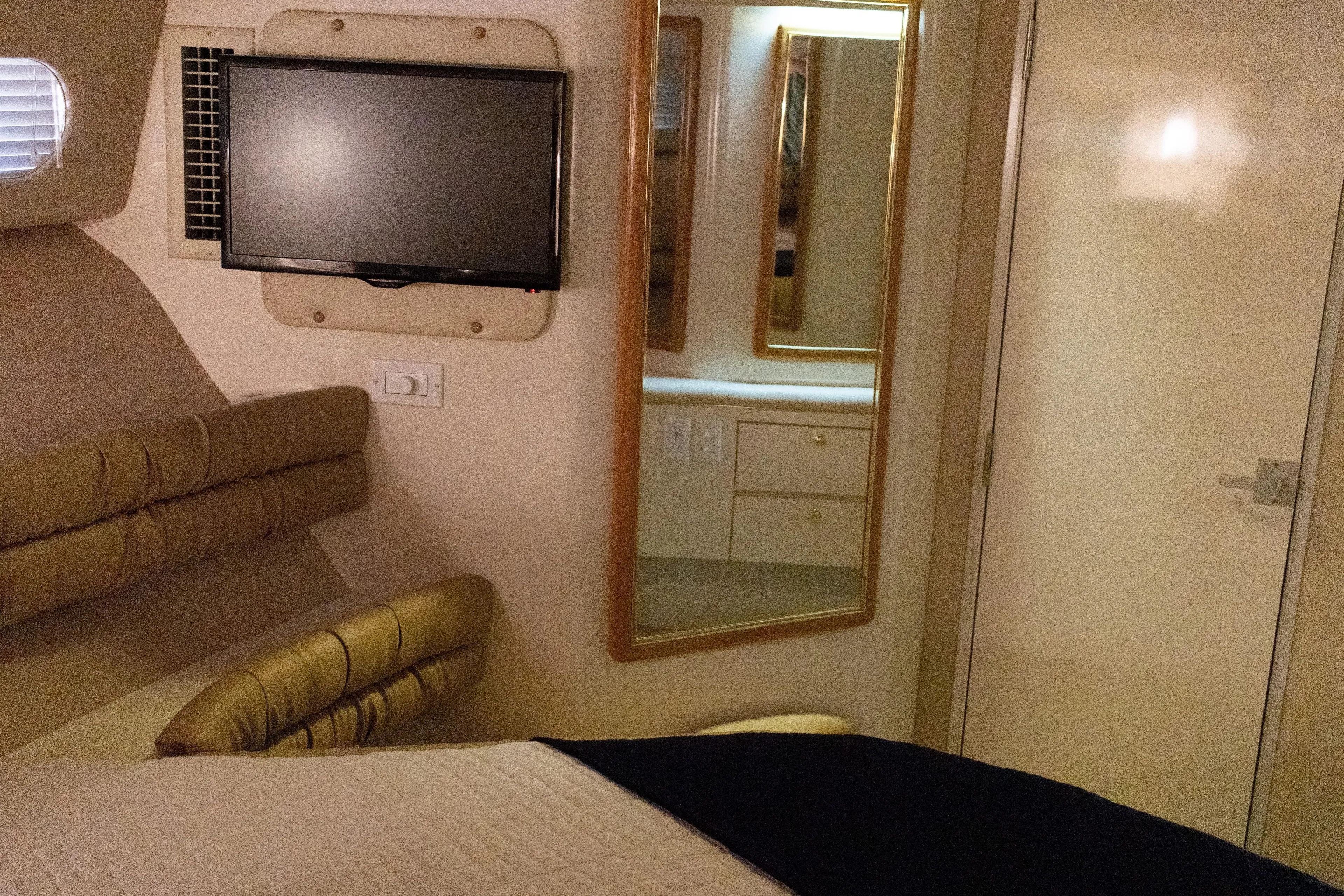  Yacht Photos Pics Luxurious interior of 1996 Sea Ray 630 Super Sun Sport yacht with TV and mirror.