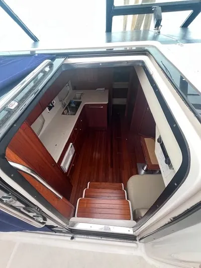 Getaway Yacht Photos Pics Interior view of 2001 Tiara Yachts 3500 Express, showcasing wooden cabinetry and flooring.