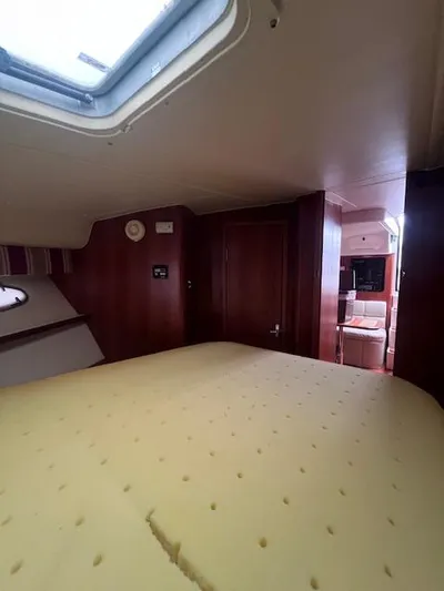 Getaway Yacht Photos Pics Interior cabin of 2001 Tiara Yachts 3500 Express with skylight and cozy furnishings.