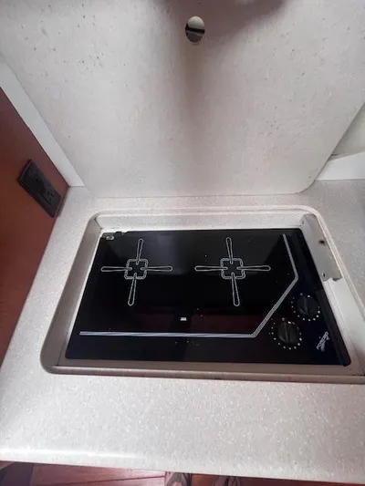 Getaway Yacht Photos Pics 2001 Tiara Yachts 3500 Express stovetop in cabin kitchen area.