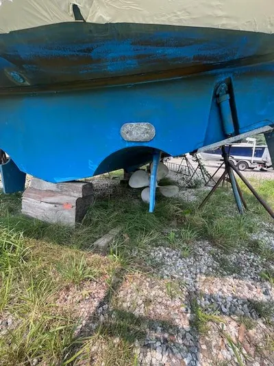 Getaway Yacht Photos Pics 2001 Tiara Yachts 3500 Express boat hull on dry land, blue paint, propeller visible.