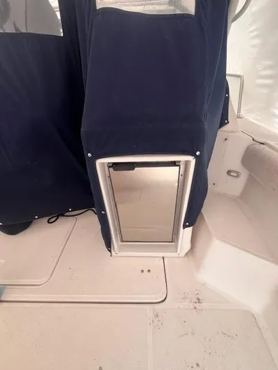 Getaway Yacht Photos Pics 2001 Tiara Yachts 3500 Express interior with covered equipment and seating area.