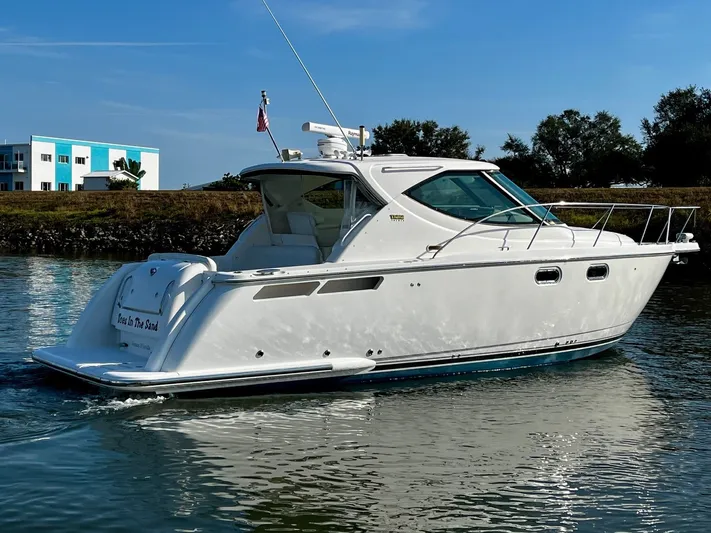 " Toes In The Sand " Yacht Photos Pics 2011 Tiara Yachts Sovran on calm water.