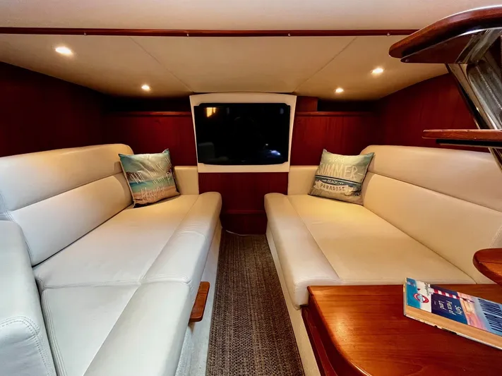 " Toes In The Sand " Yacht Photos Pics Interior of 2011 Tiara Yachts Sovran with beige sofas.