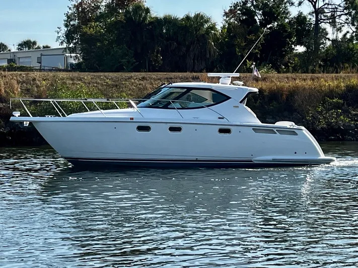 " Toes In The Sand " Yacht Photos Pics 2011 Tiara Yachts Sovran on calm water.