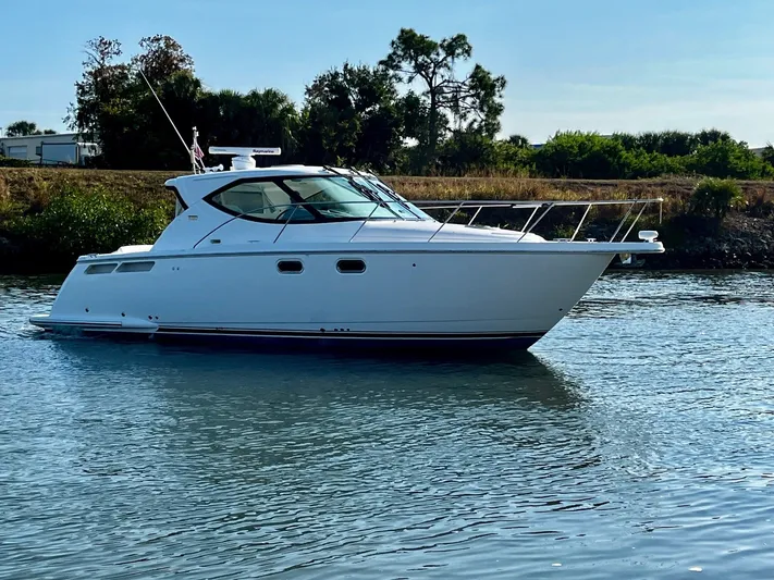 " Toes In The Sand " Yacht Photos Pics 2011 Tiara Yachts Sovran on calm water.