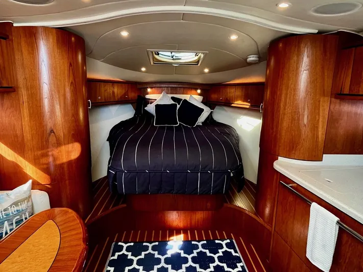 " Toes In The Sand " Yacht Photos Pics Luxurious cabin of 2011 Tiara Yachts Sovran with wood finish.