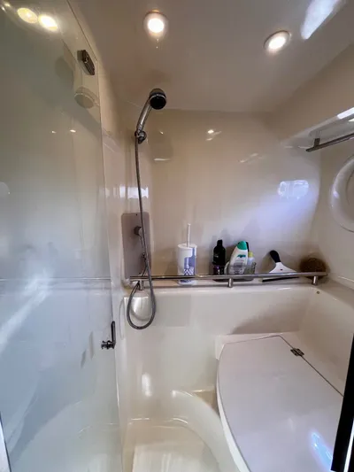 " Toes In The Sand " Yacht Photos Pics 2011 Tiara Yachts Sovran bathroom with shower and toiletries.