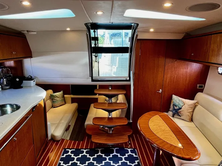 " Toes In The Sand " Yacht Photos Pics Interior of a 2011 Tiara Yachts Sovran with elegant wood finish.