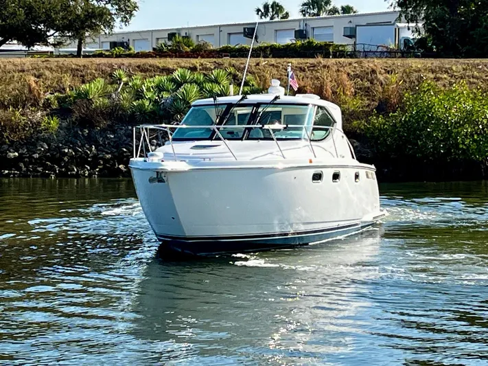 " Toes In The Sand " Yacht Photos Pics 2011 Tiara Yachts Sovran on calm water.