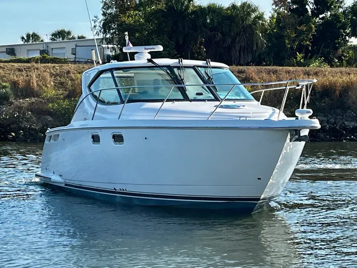 " Toes In The Sand " Yacht Photos Pics 2011 Tiara Yachts Sovran on calm water.