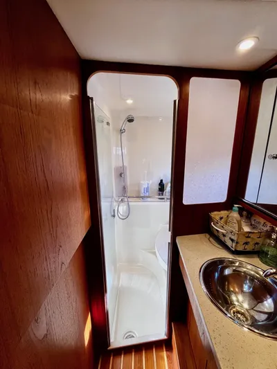 " Toes In The Sand " Yacht Photos Pics Tiara Yachts Sovran 2011 bathroom with shower and sink.