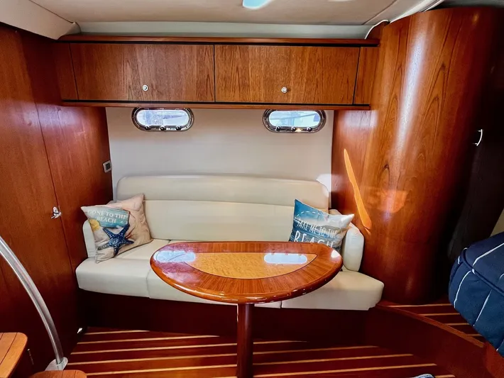 " Toes In The Sand " Yacht Photos Pics 2011 Tiara Yachts Sovran interior with wooden furnishings.
