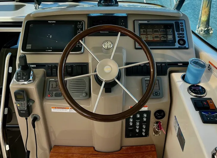 " Toes In The Sand " Yacht Photos Pics 2011 Tiara Yachts Sovran helm with modern navigation equipment.