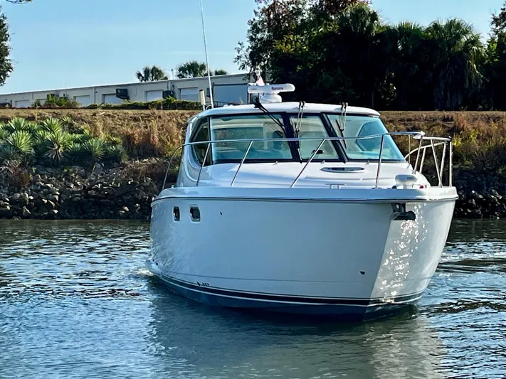 " Toes In The Sand " Yacht Photos Pics 2011 Tiara Yachts Sovran on calm water.