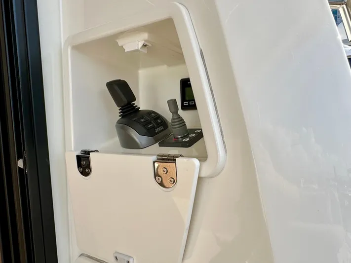 Pearl Voyage Yacht Photos Pics Control panel of 2023 Prestige 520 yacht with joystick and display.