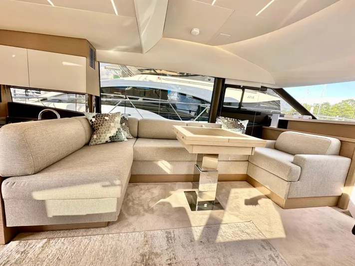 Pearl Voyage Yacht Photos Pics Luxurious interior of 2023 Prestige 520 yacht with elegant seating and modern design.