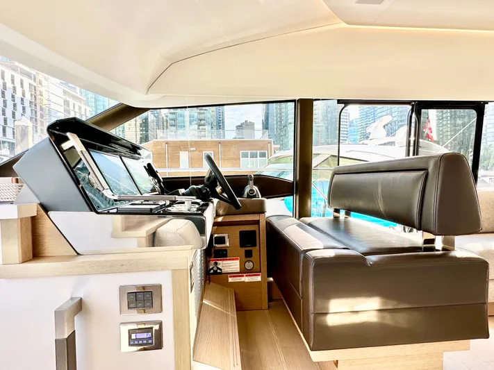 Pearl Voyage Yacht Photos Pics Interior of 2023 Prestige 520 yacht with modern helm and leather seating.