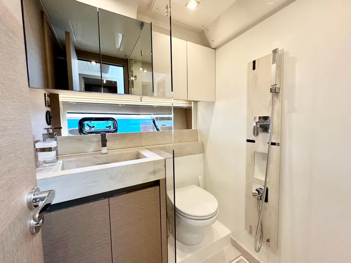 Pearl Voyage Yacht Photos Pics Modern bathroom in 2023 Prestige 520 yacht, featuring sleek design and high-end fixtures.