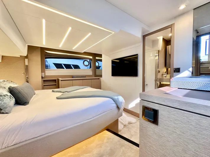 Pearl Voyage Yacht Photos Pics Luxurious interior of a 2023 Prestige 520 yacht, featuring a modern bedroom design.