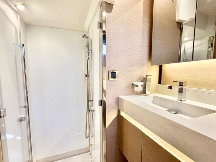 Pearl Voyage Yacht Photos Pics Modern bathroom in 2023 Prestige 520 yacht with sleek shower and elegant sink.