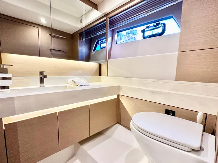 Pearl Voyage Yacht Photos Pics Luxurious bathroom interior on a 2023 Prestige 520 yacht, featuring modern fixtures and elegant design.