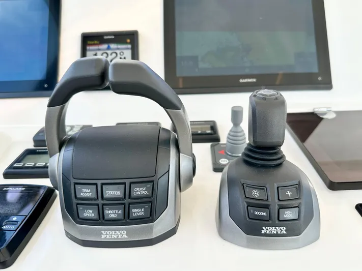 Pearl Voyage Yacht Photos Pics Volvo Penta controls on a 2023 Prestige 520 yacht dashboard with navigation screens.