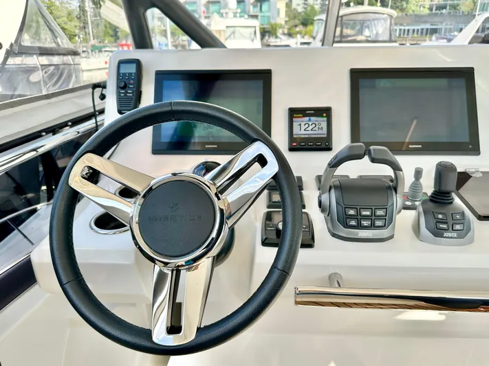 Pearl Voyage Yacht Photos Pics Helm of 2023 Prestige 520 yacht with modern controls and dual displays.