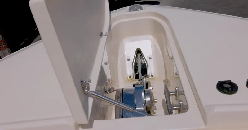  Yacht Photos Pics Anchor compartment of 2018 Grady-White Freedom 307 boat, featuring a winch and storage area.