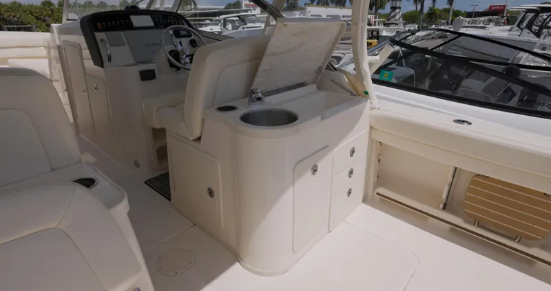  Yacht Photos Pics 2018 Grady-White Freedom 307 boat interior with helm and sink area.