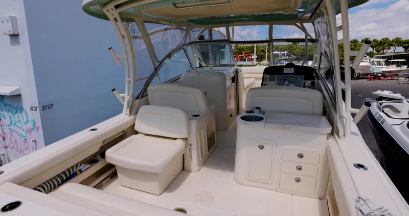  Yacht Photos Pics 2018 Grady-White Freedom 307 boat interior with seating and storage compartments.