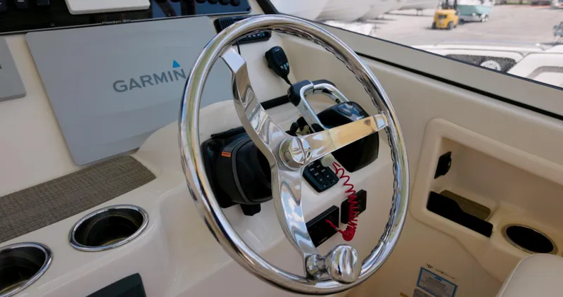  Yacht Photos Pics Steering wheel of 2018 Grady-White Freedom 307 boat with Garmin navigation system.