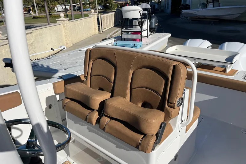  Yacht Photos Pics 2021 Sea Hunt Gamefish 27 Coffin Box boat with brown cushioned seating.