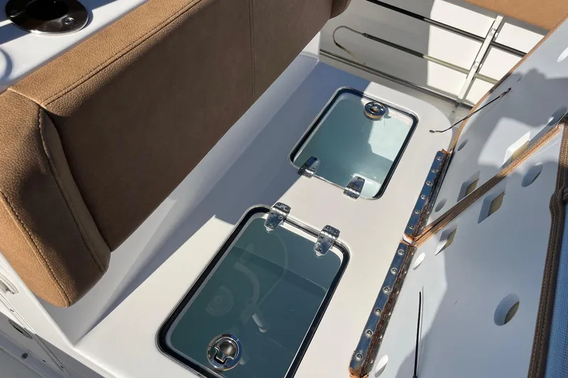  Yacht Photos Pics 2021 Sea Hunt Gamefish 27 Coffin Box interior with cushioned seating and storage compartments.