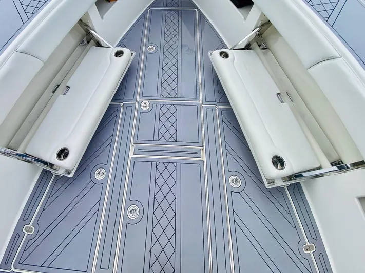 Part Time Hooker Yacht Photos Pics 2009 SeaVee IPS boat deck with cushioned seating and patterned flooring.